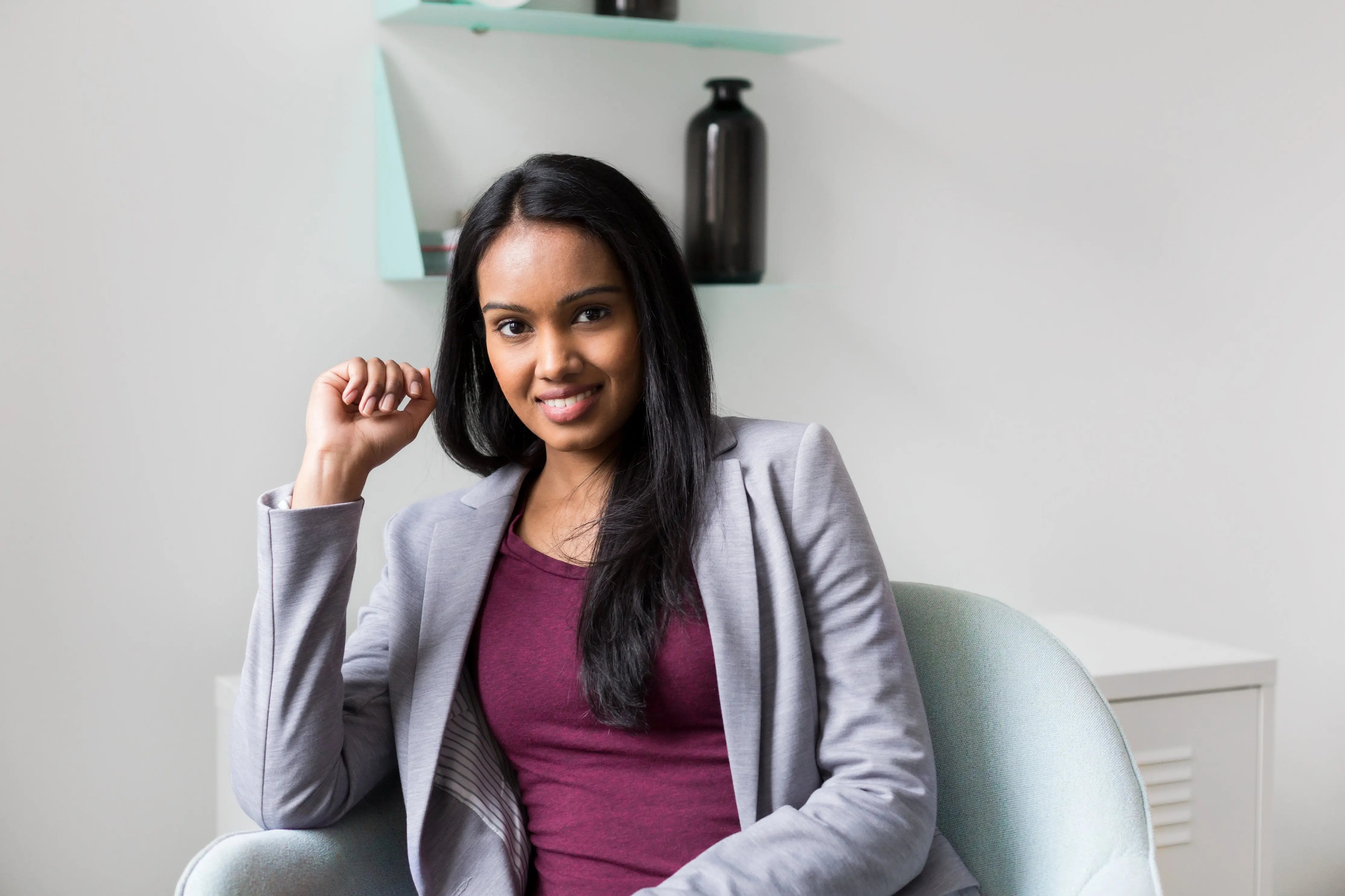 Woman with white teeth smiling in dentist chair